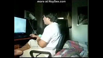 Sucking cock while their friend playing games on his pc