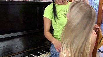 Sexy lesbians toy muffs on piano