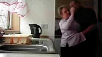 Mum and dad home alones having fun in the kitchen. Hidden cam