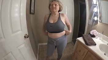 Fit granny stripping out of sports bra and yoga pants