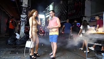 Pattaya after midnight. Street view. Thai ladies and couples