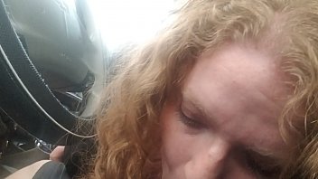 BBW Redhead sucks drivers cock while he drives in the middle of nowhere