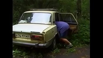 Russian couple is fucked by car in the woods