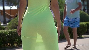 Naughty Lada walks around in a transparent dress in public with no panties