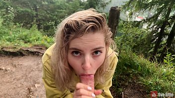 Cute girl takes it deep in her mouth under the rain - Eva Elfie