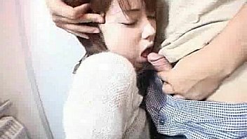 An Asian girl is giving a guy a blow job on the toil from http://alljapanese.net