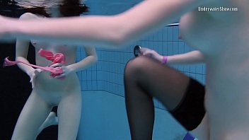 Nudist girls swimming in public pool