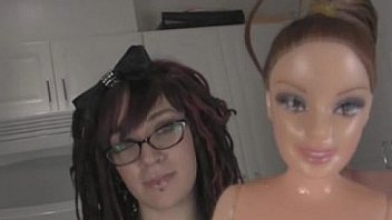 Young whore inserting babrie doll in her pussy