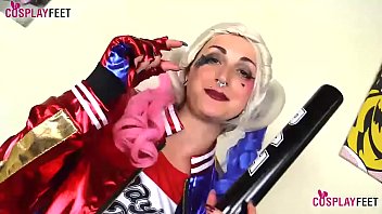 Hot cosplayer Medusa Blonde plays Harley Quinn today. With her black pantyhose she does all sort of things, till giving a perfect footjob to her own baseball bat.