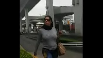 Busty latina walking on the street bouncing her huge boobs