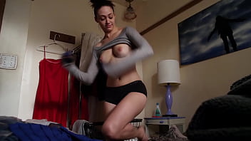 Emmy Rossum shows off the breasts while getting dressed (brought to you by Celeb Eclipse)