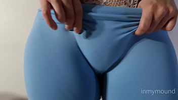Puffy pussy girl in blue leggings and a big tits showing off.